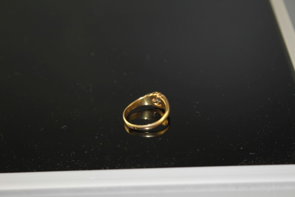 A George V 18ct gold and claw set solitaire diamond ring,